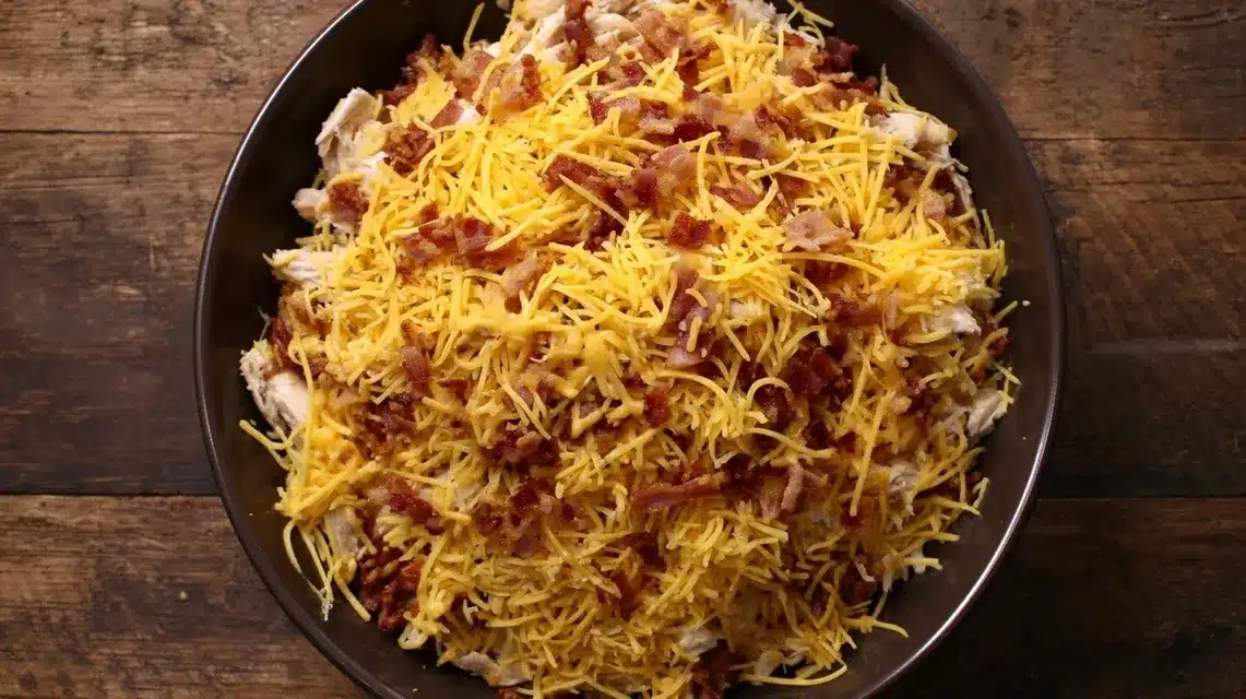 Combining filling ingredients Chicken bacon ranch tater tot casserole filling