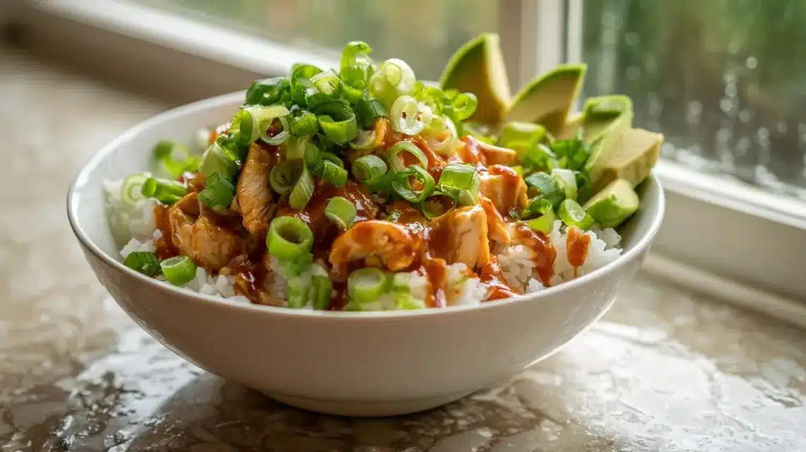 Final garnish on BBQ chicken bowl Finished honey BBQ chicken bowls ready to eat