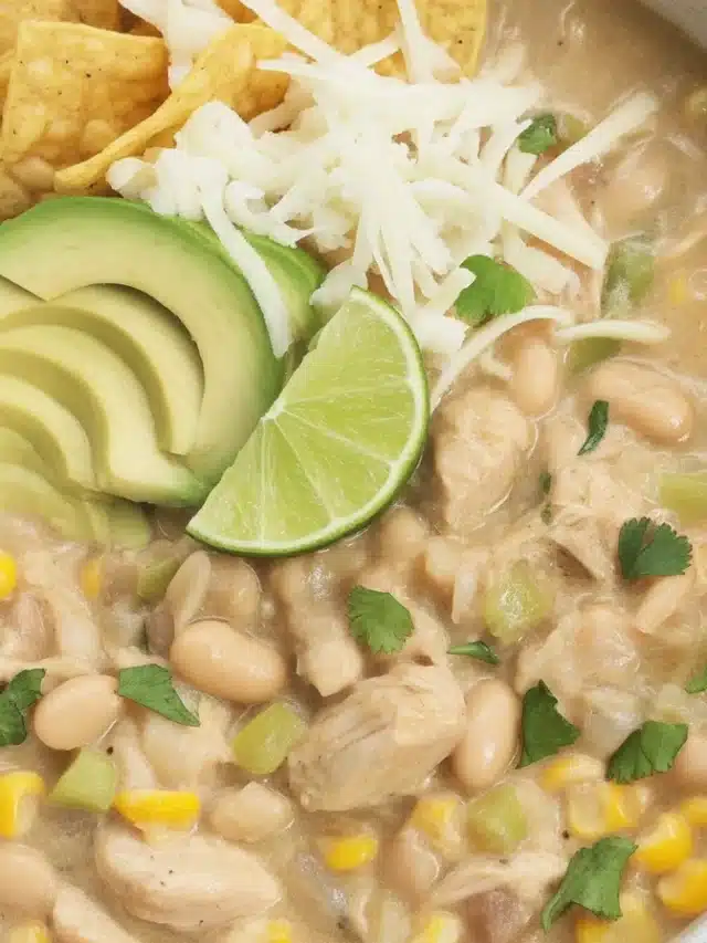 Bowl of creamy white chicken chili with chunks of chicken and white beans