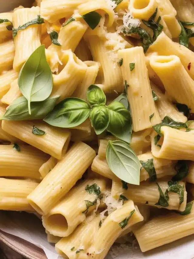 A bowl of flavorful zucchini pasta topped with garlic, lemon, and parmesan.