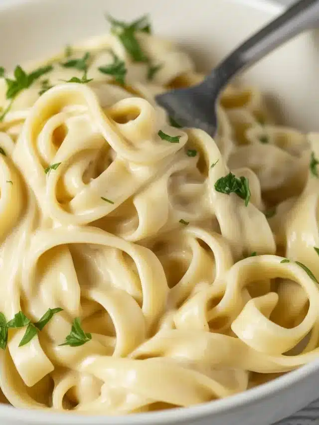 Boursin Cheese Pasta with tomatoes, garlic, and creamy sauce in a bowl.