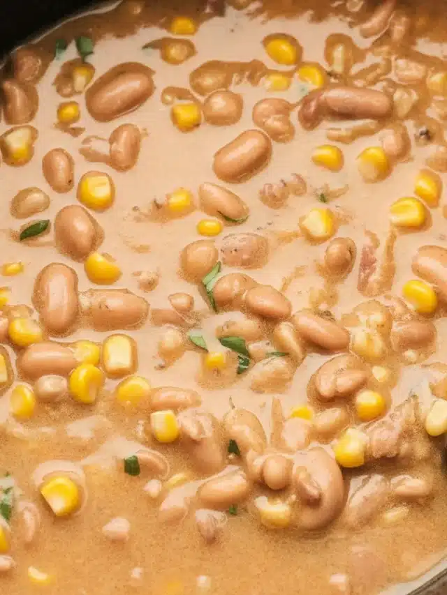 Bowl of creamy White Chicken Chili made in a Slow Cooker with chicken, beans, and spices.