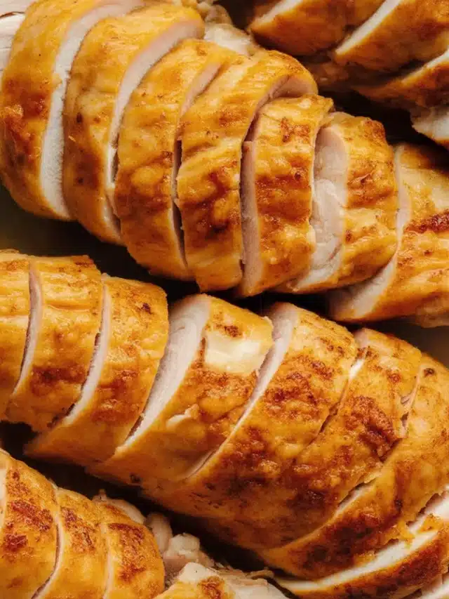 Juicy slow-cooked chicken breasts in a crock pot seasoned to perfection.