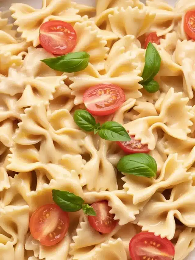 Creamy Boursin Pasta topped with cherry tomatoes and garlic, ready to serve.