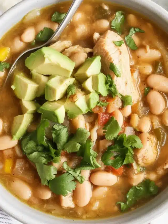 Bowl of creamy White Bean Chicken Chili with chicken and spices.