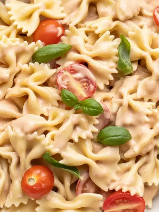Creamy Pasta Boursin with tomatoes and garlic served in a bowl, inspired by viral TikTok recipes.