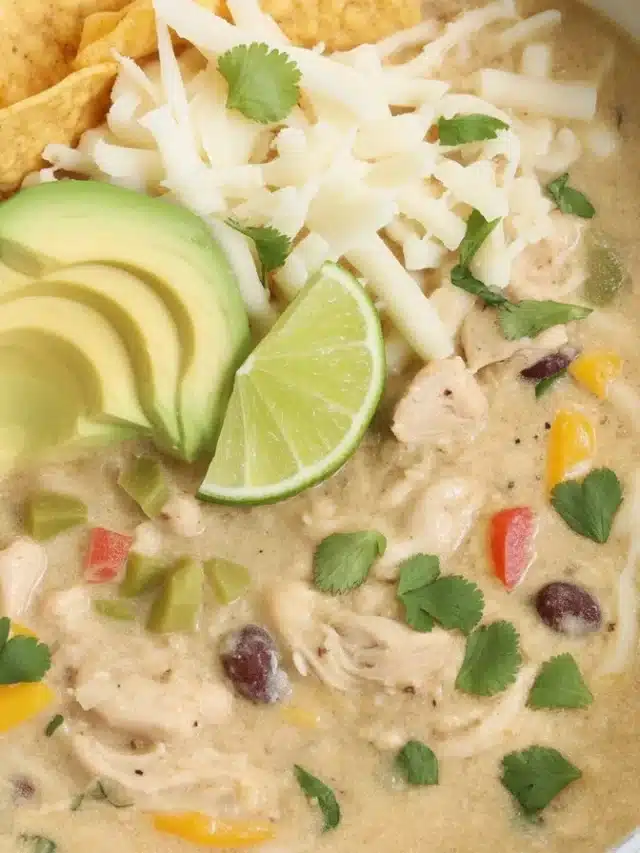 Bowl of easy White Chicken Chili with shredded chicken, beans, and spices.