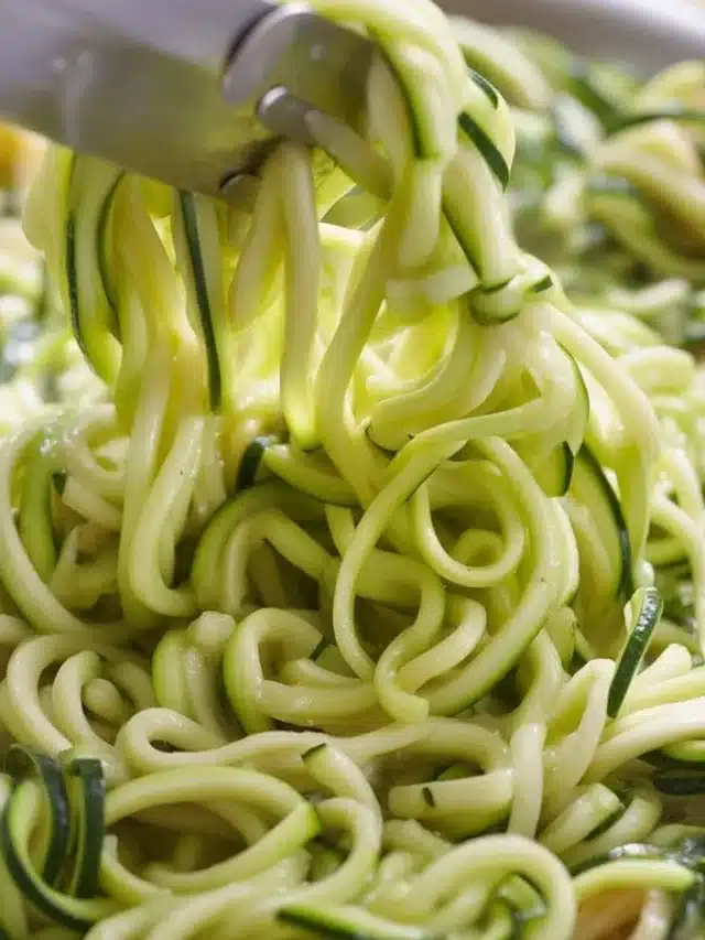 Delicious zucchini noodles tossed with garlic, basil, and parmesan cheese.