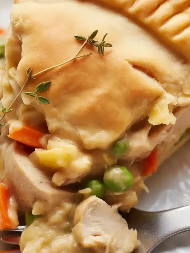 A delicious homemade chicken pot pie from scratch with a flaky crust and creamy filling.