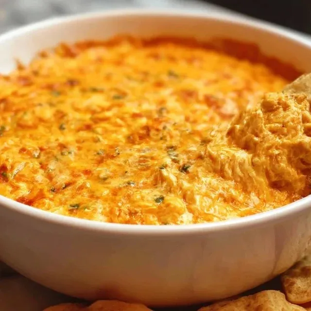 Delicious Buffalo Chicken Dip served with tortilla chips and veggies.