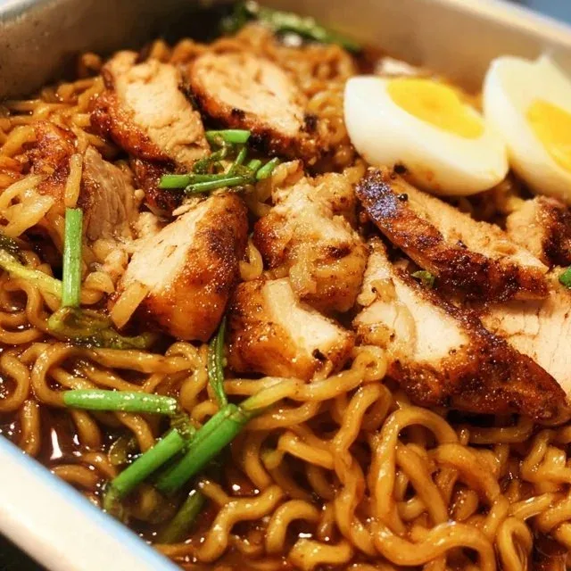 Delicious bowl of Blackstone Chicken Teriyaki Ramen with vibrant toppings