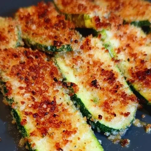 Blackstone crispy parmesan zucchini slices on a plate