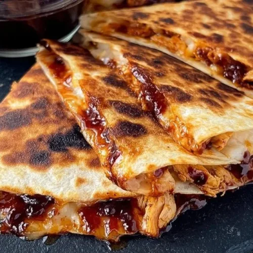 Delicious Blackstone Hot Honey BBQ Chicken Quesadillas served on a plate