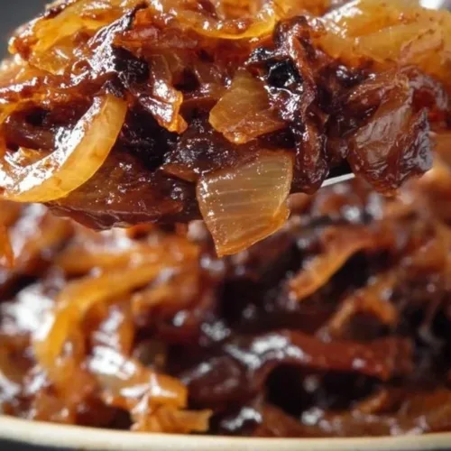 Deliciously caramelized onions in a skillet, showcasing their rich golden color.