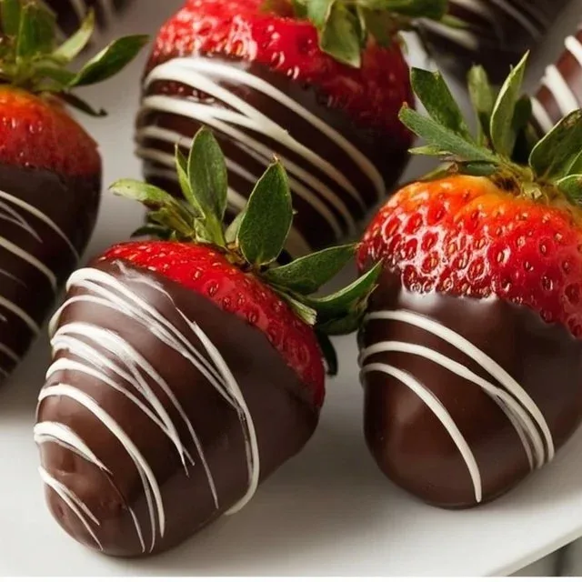 Delicious chocolate covered strawberries drizzled with white chocolate