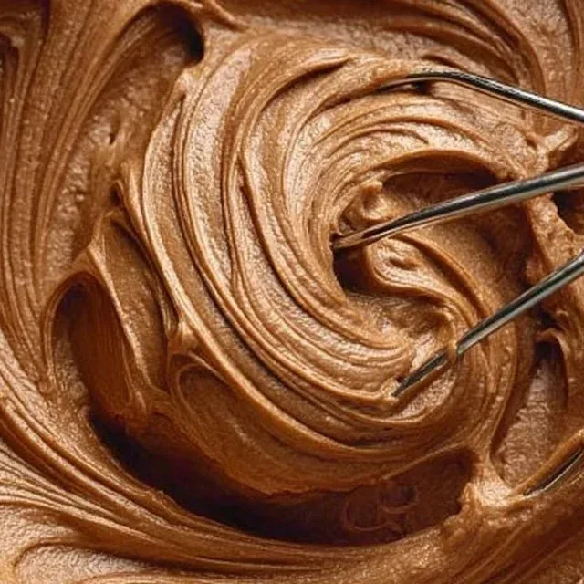 Delicious Chocolate Peanut Butter Frosting on a chocolate cake