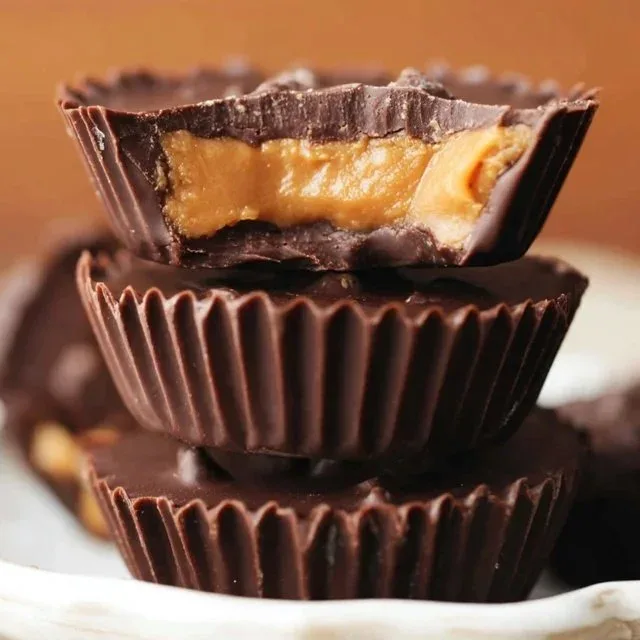 A plate of homemade peanut butter cups with chocolate coating