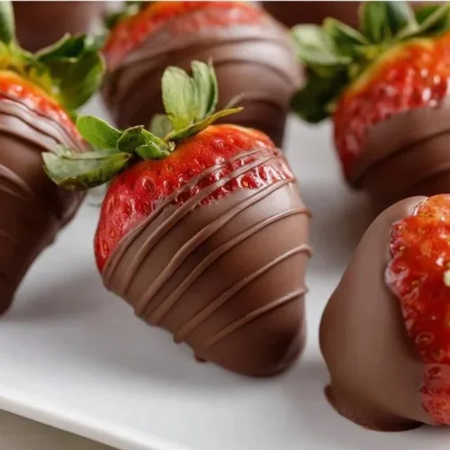 Delicious chocolate covered strawberries on a platter