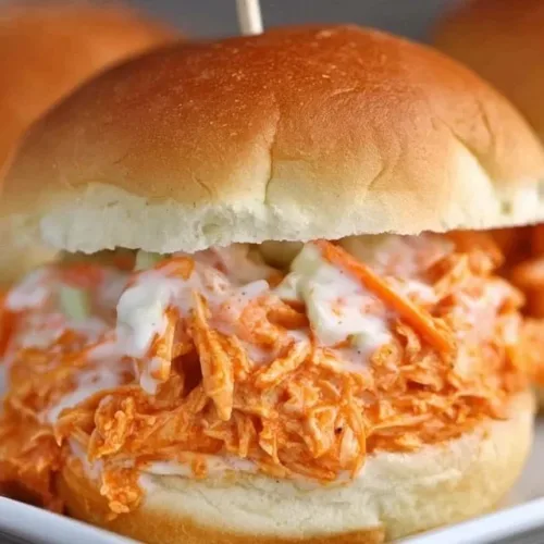 Delicious slow cooker buffalo chicken sliders served on a platter