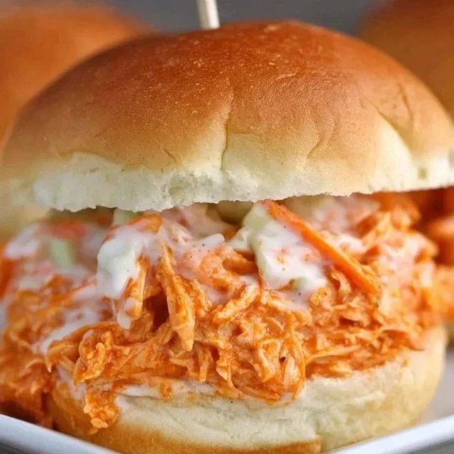 Delicious slow cooker buffalo chicken sliders served on a platter
