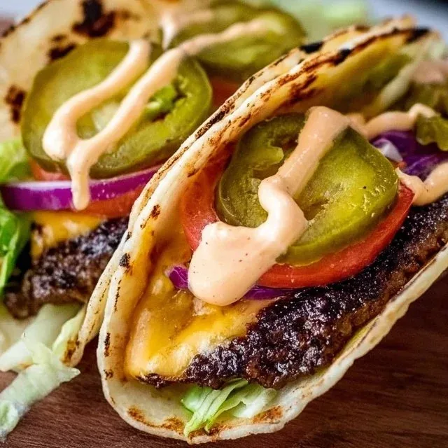 Smash Burger Tacos served with fresh toppings and savory beef patties.