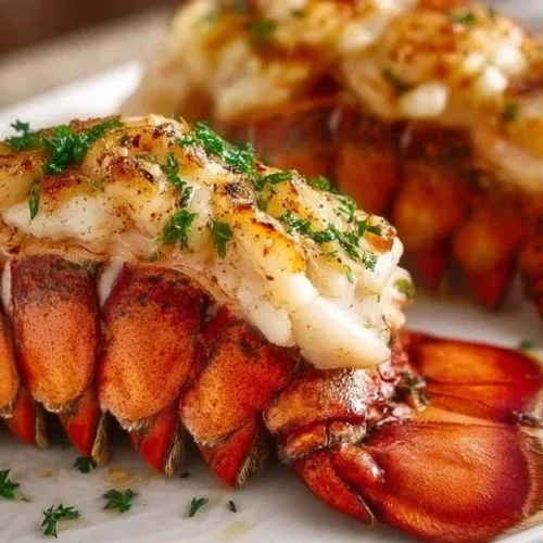 Deliciously baked lobster tails with garlic butter, ready to serve.