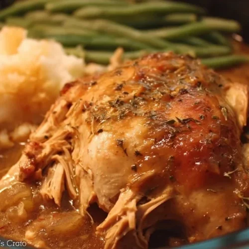 Crockpot Mississippi Chicken served on a plate with sides.