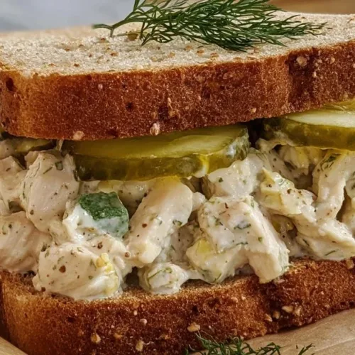 High Protein Dill Pickle Chicken Salad featuring chicken, dill pickles, and healthy ingredients.