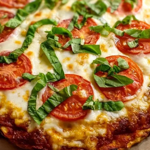 Delicious Margarita Pizza topped with fresh tomatoes and basil