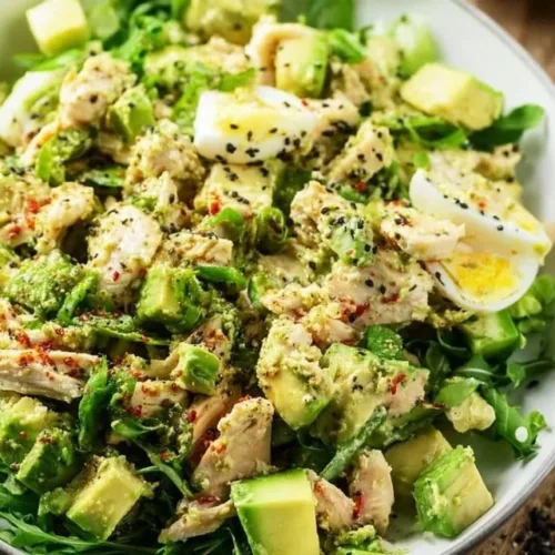 Mayo free avocado chicken salad served in a bowl with fresh ingredients