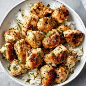 15-Minute Garlic Butter Chicken Bites served with herbs and spices
