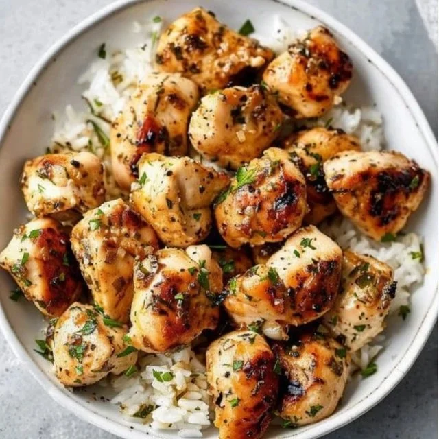 15-Minute Garlic Butter Chicken Bites served with herbs and spices