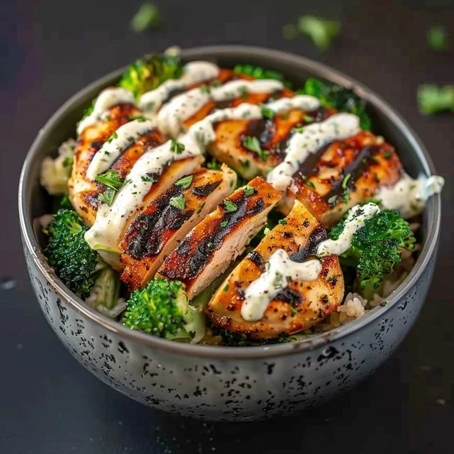 Delicious grilled chicken broccoli bowls with creamy garlic sauce