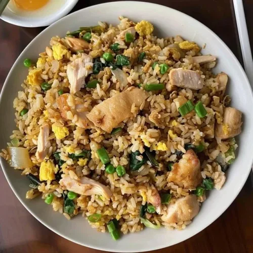 High protein fried rice bowl with vegetables and chicken
