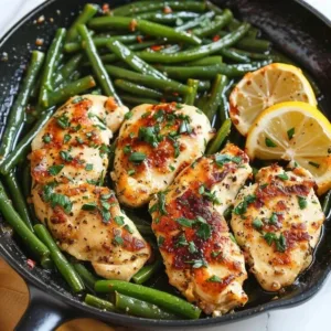 Lemon Garlic Butter Chicken garnished with herbs on a plate
