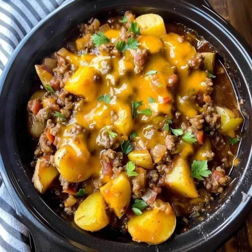 Slow Cooker Cowboy Potato Casserole served in a bowl with toppings