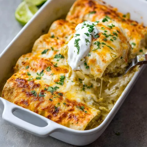 Easy Green Chile Chicken Enchiladas on a plate garnished with cilantro