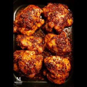 Juicy oven baked boneless skinless chicken thighs served with herbs
