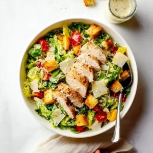 A vibrant Spicy Southwest Chicken Salad garnished with fresh vegetables and spices.