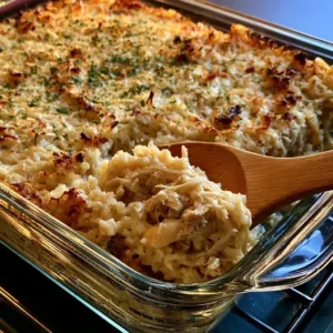 Delicious chicken and rice casserole baked with creamy sauce and topped with herbs