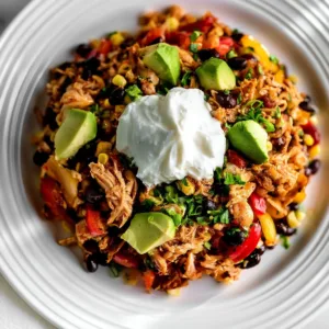Easy chicken burrito casserole with toppings in a baking dish.