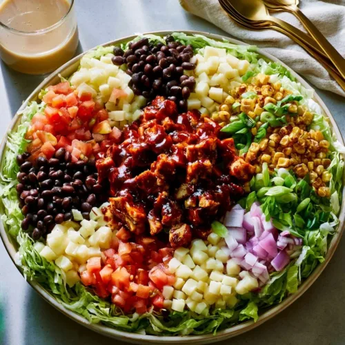 Healthy BBQ chicken chopped salad with fresh ingredients and dressing