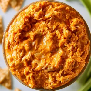 Delicious Slow Cooker Buffalo Chicken Dip served in a bowl with tortilla chips