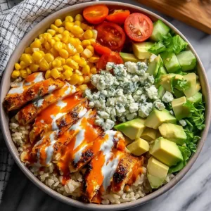 Delicious Spicy Buffalo Chicken Bowls topped with fresh ingredients