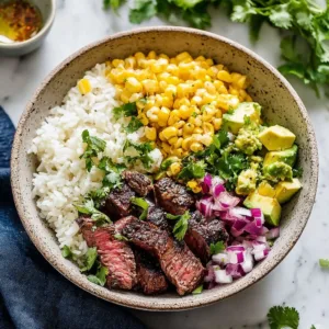 Delicious street corn steak rice bowl with tender steak and vibrant flavors