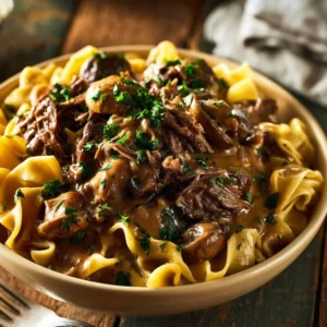 Delicious slow cooker beef stroganoff served with noodles